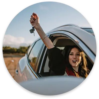 Woman driving a car with renewed insurance